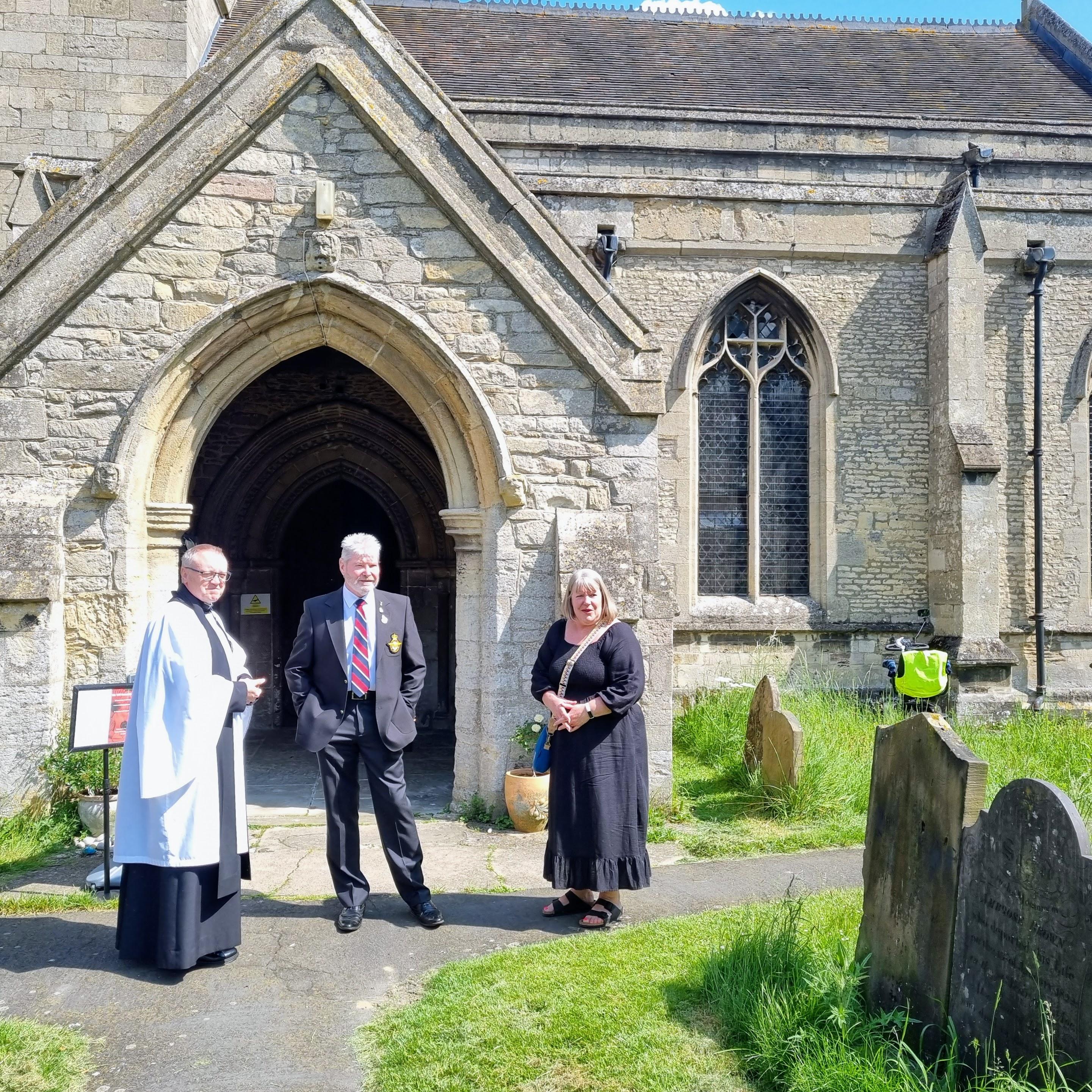 a photo of reverend al Jenkins, the chairman of Ruskington parish council, Councillor owen ditch and the parish clerk, Kathryn Locke out side all saints church in Ruskington.