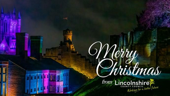 A vibrant display of Christmas lights adorns Lincolnshire, showcasing a joyful holiday spirit in the evening sky.