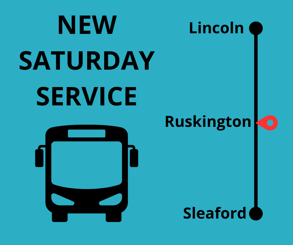 A bus displaying a red line and a sign that reads "New Saturday Service."