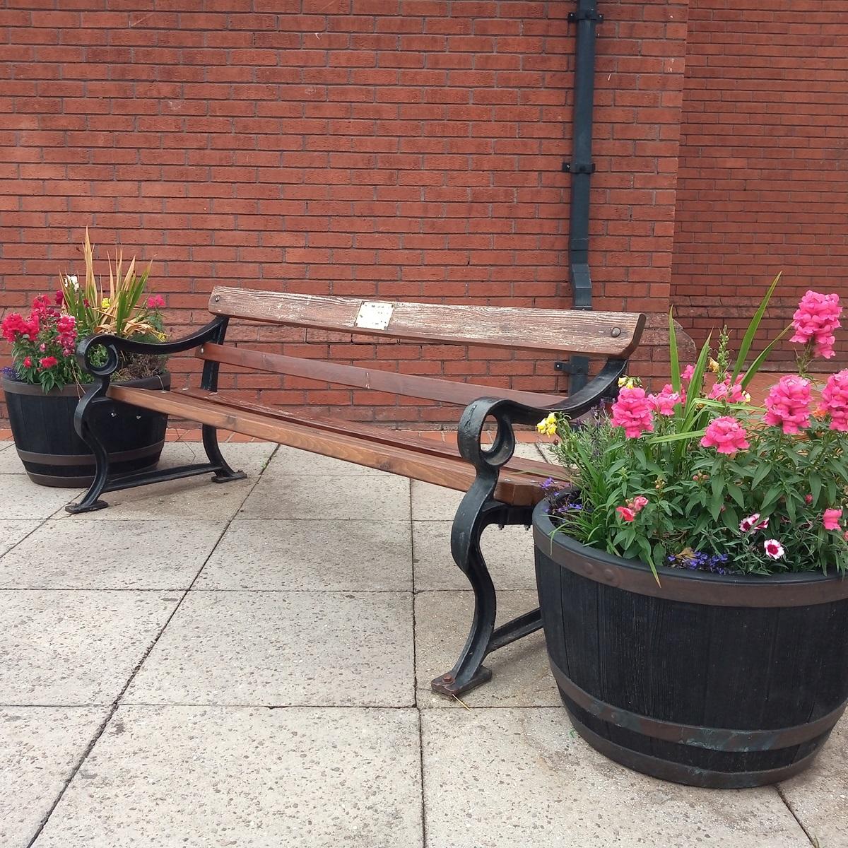 WI flower tubs and bench outside the library in Ruskington.