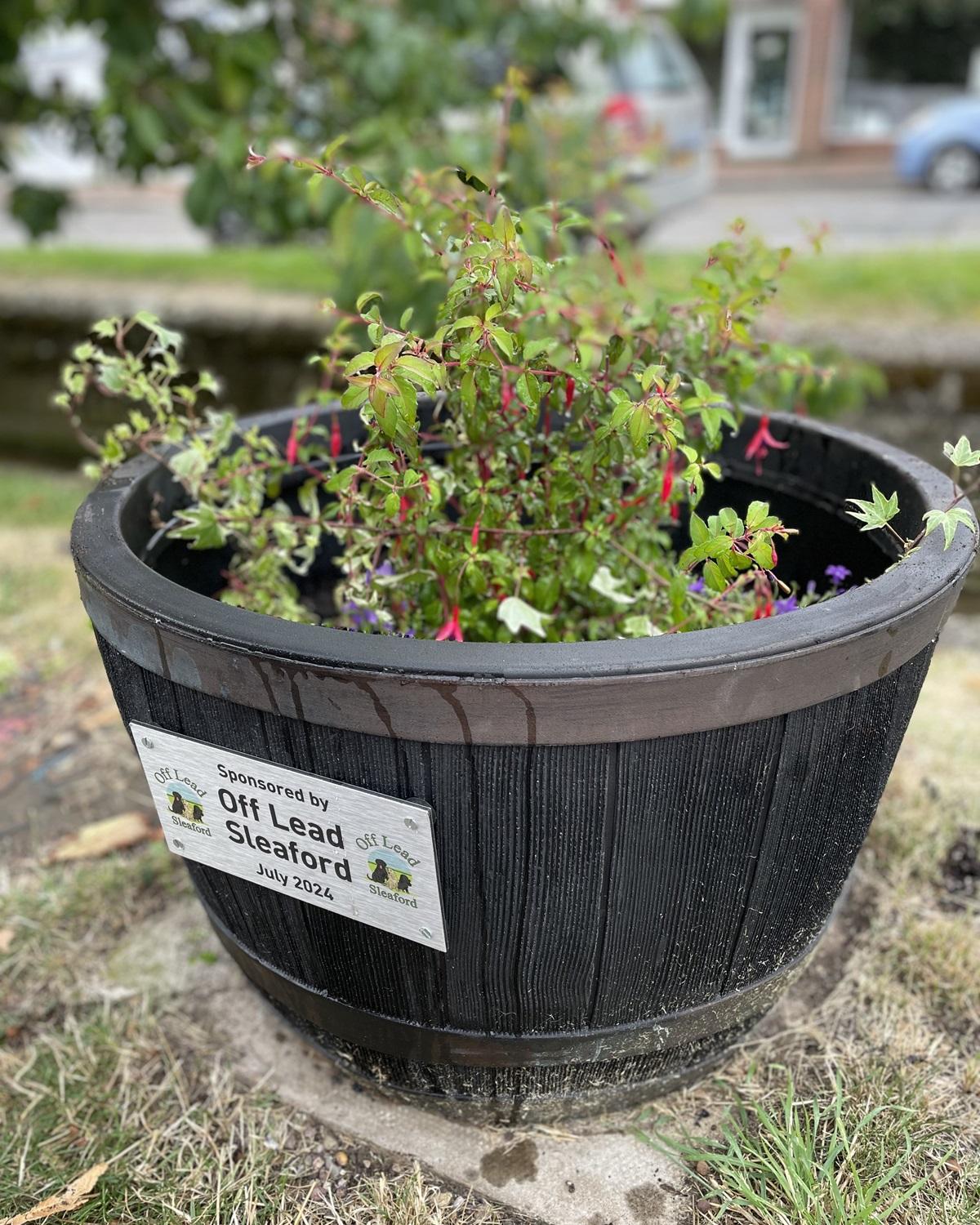 Off Lead Sleaford flower tub by the Beck in Ruskington.